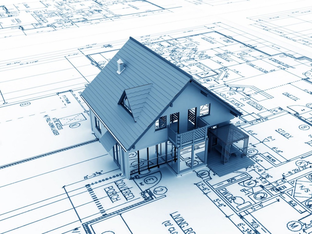 House development and renovation plans graphic with drafting and house.