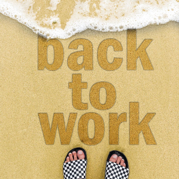 Back to work written on the beach